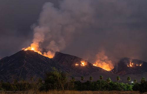 Free Stunning view of a wildfire blazing across hills at night in Redlands, CA. Stock Photo