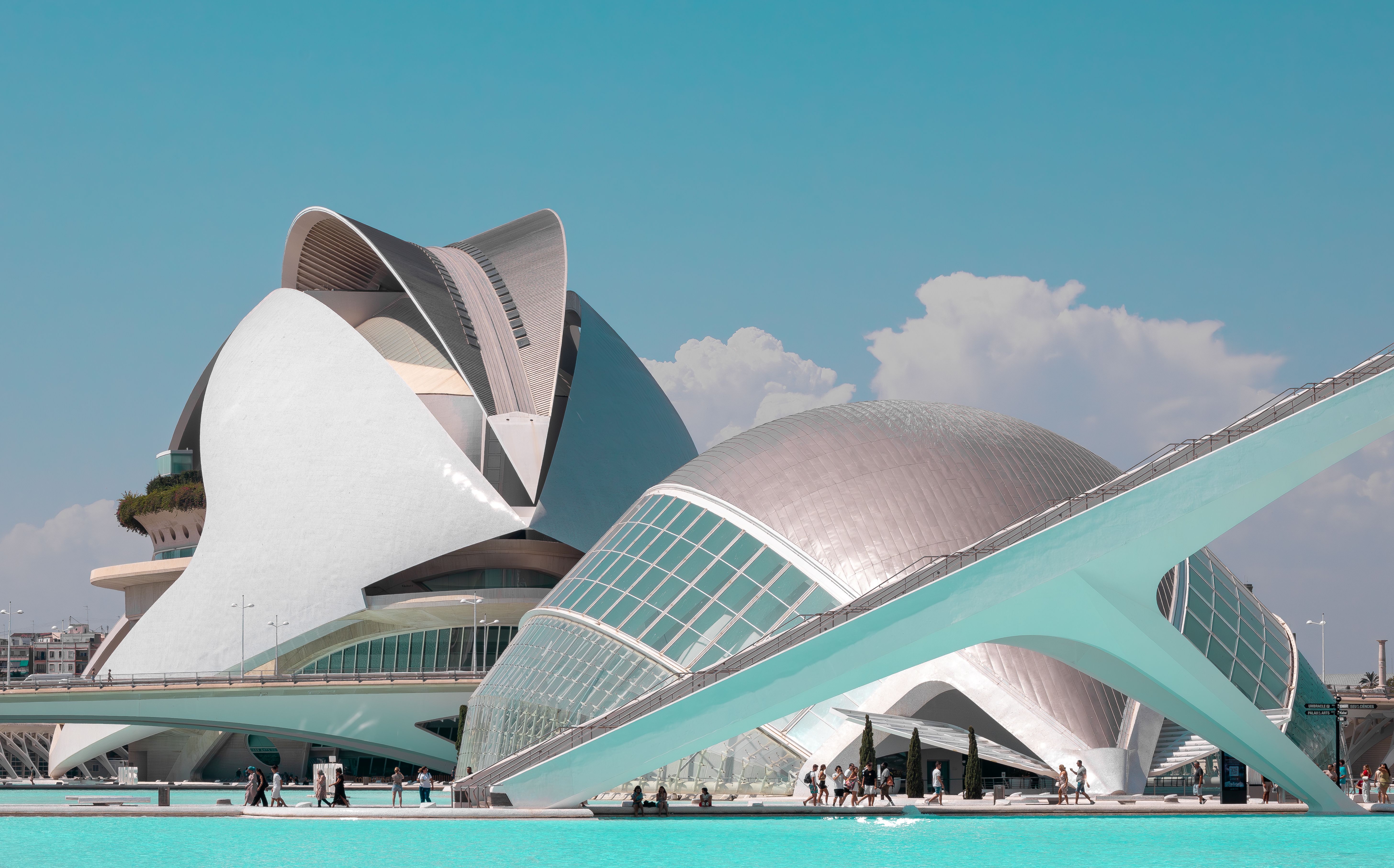 Modern architectural structures by a blue water body