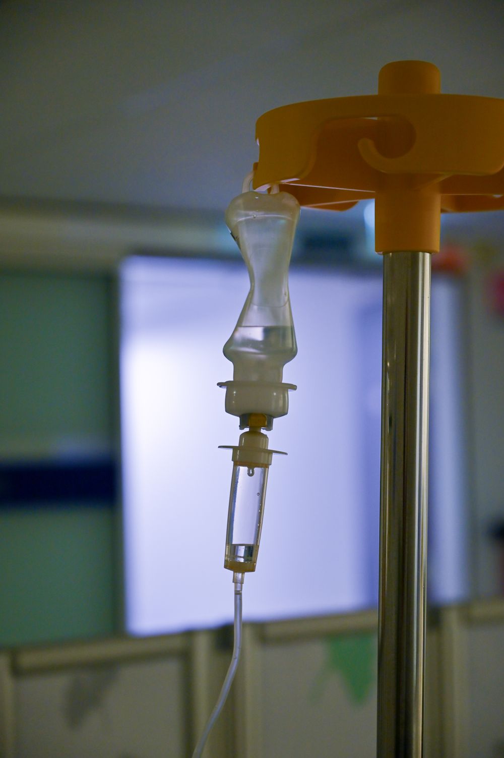 Close-up of an IV drip line during a monitored infusion
