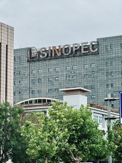 Modern Sinopec building in urban Tianjin with contemporary glass facade.