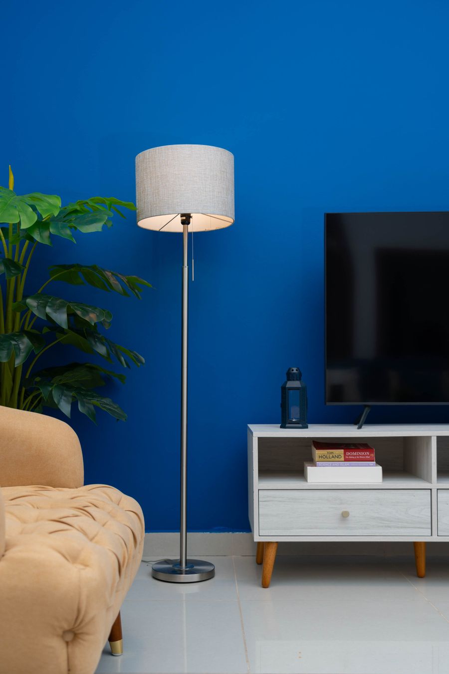 Finished residential living room with a striking blue painted accent wall