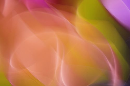 Free A dynamic and colorful abstract image showcasing vibrant light waves in pink, orange, and green hues, creating a surreal visual experience. Stock Photo