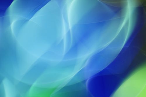 Free Vibrant abstract image with smooth, dynamic blue and green curves creating a flowing wave-like background. Stock Photo