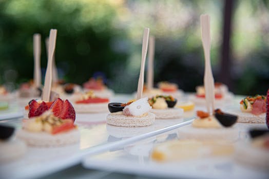 Chic canapés with fresh toppings elegantly displayed on a tray, perfect for a sophisticated event.