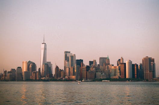 A stunning view of the New York City skyline featuring iconic skyscrapers during sunset. Perfect for urban themes.