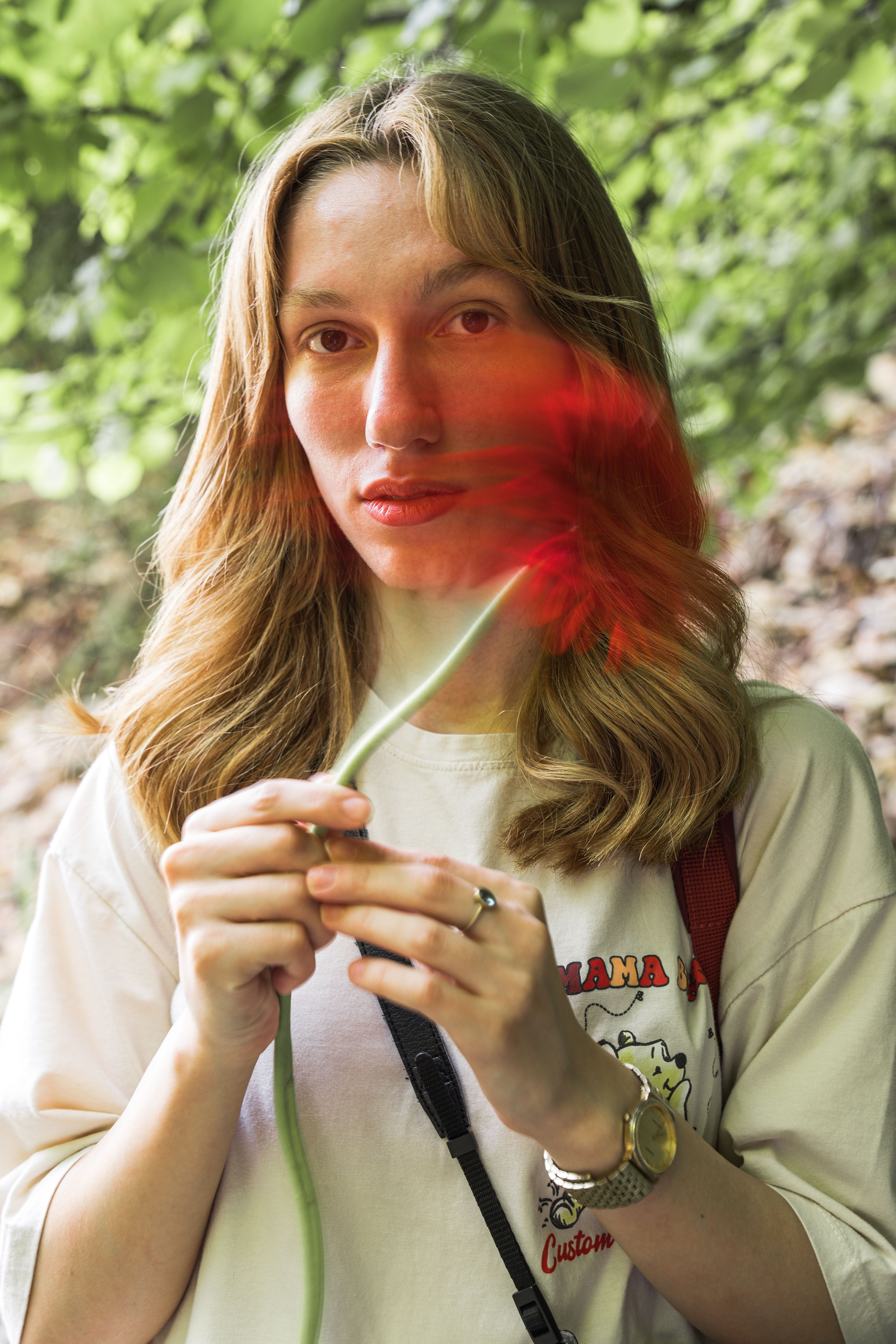 A woman holding a flower in her hand · Free Stock Photo