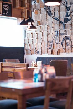 Charming café interior boasting modern design and unique wall decor, perfect for relaxation.