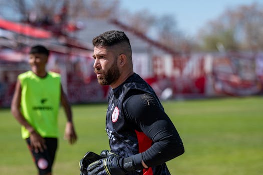 Soccer player on the field during training session on a bright day.
