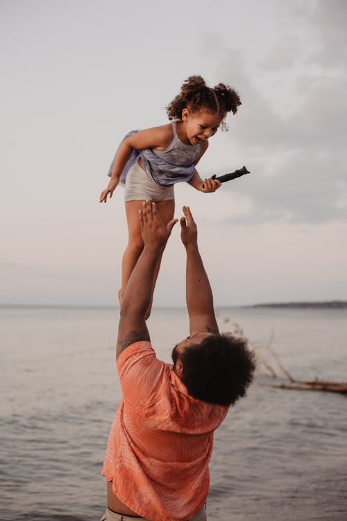 Free Father And Child Having Fun on the Beach Stock Photo