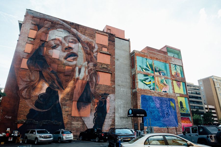 Large-scale painted murals across neighbouring city buildings