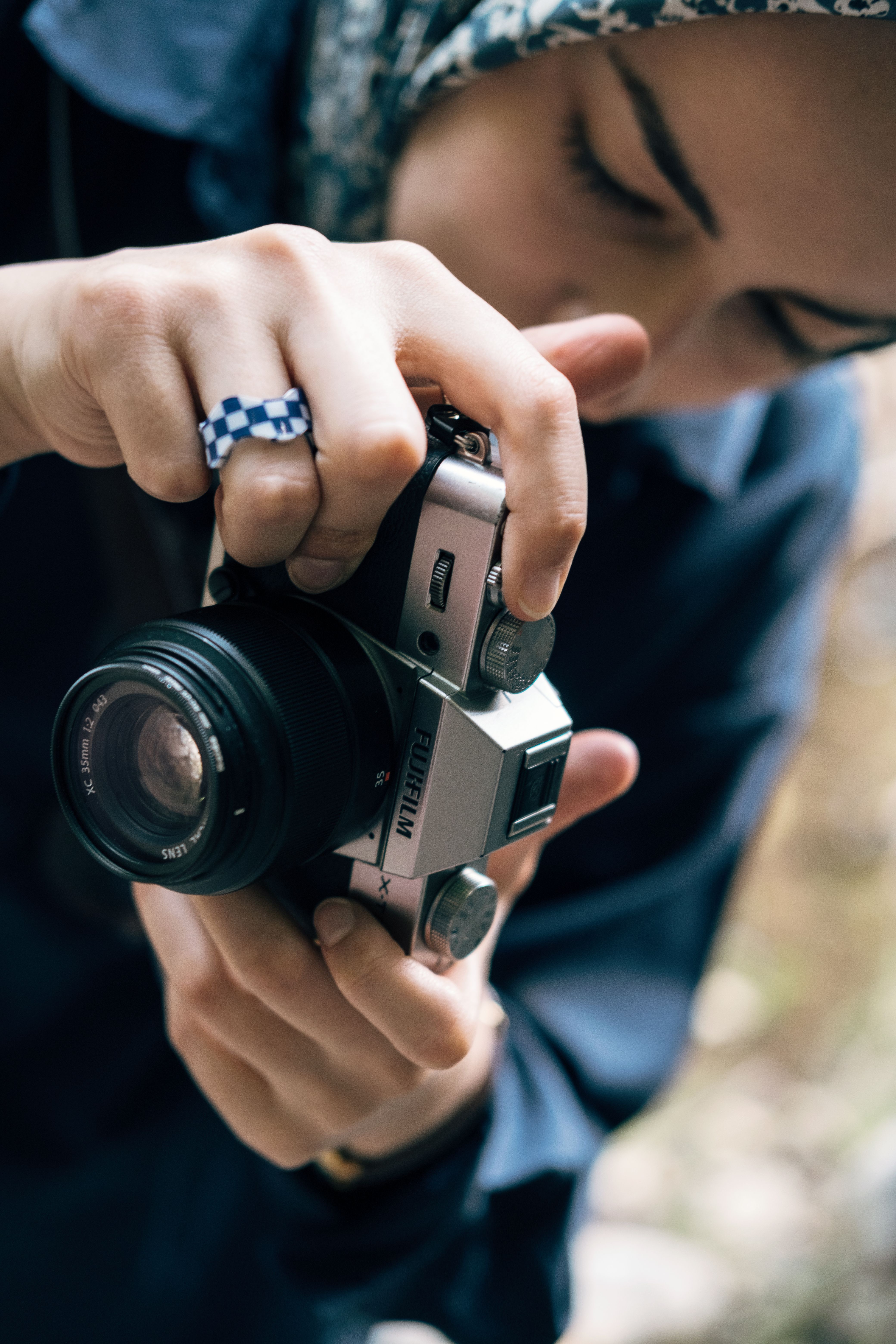 A woman taking a picture with a camera · Free Stock Photo