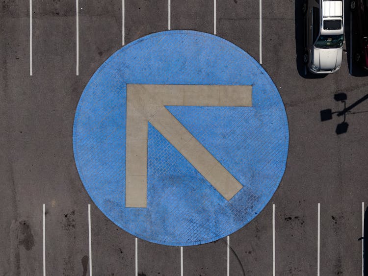 Round Blue And Gray Arrow Symbol