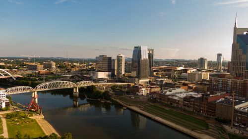 Free Drone photo of Nashville's skyline with bridges and river. Stock Photo
