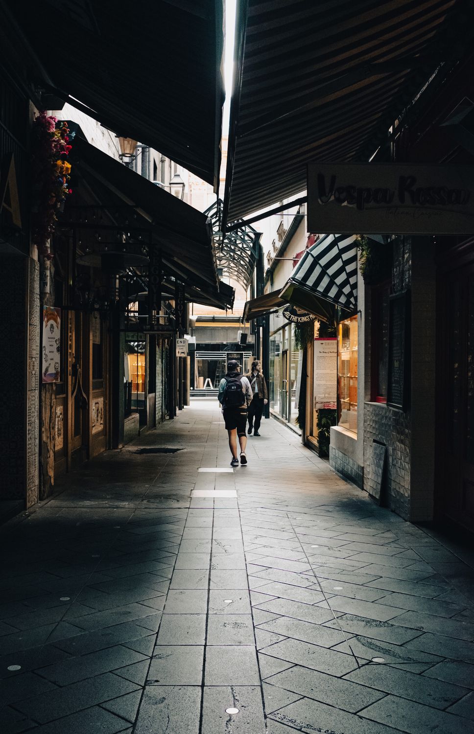 Charming Melbourne laneway with shopfronts and pedestrians
