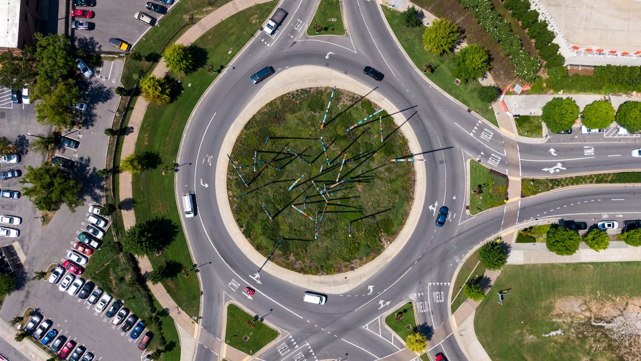 Free Vehicles Passing On A Roundabout Stock Photo