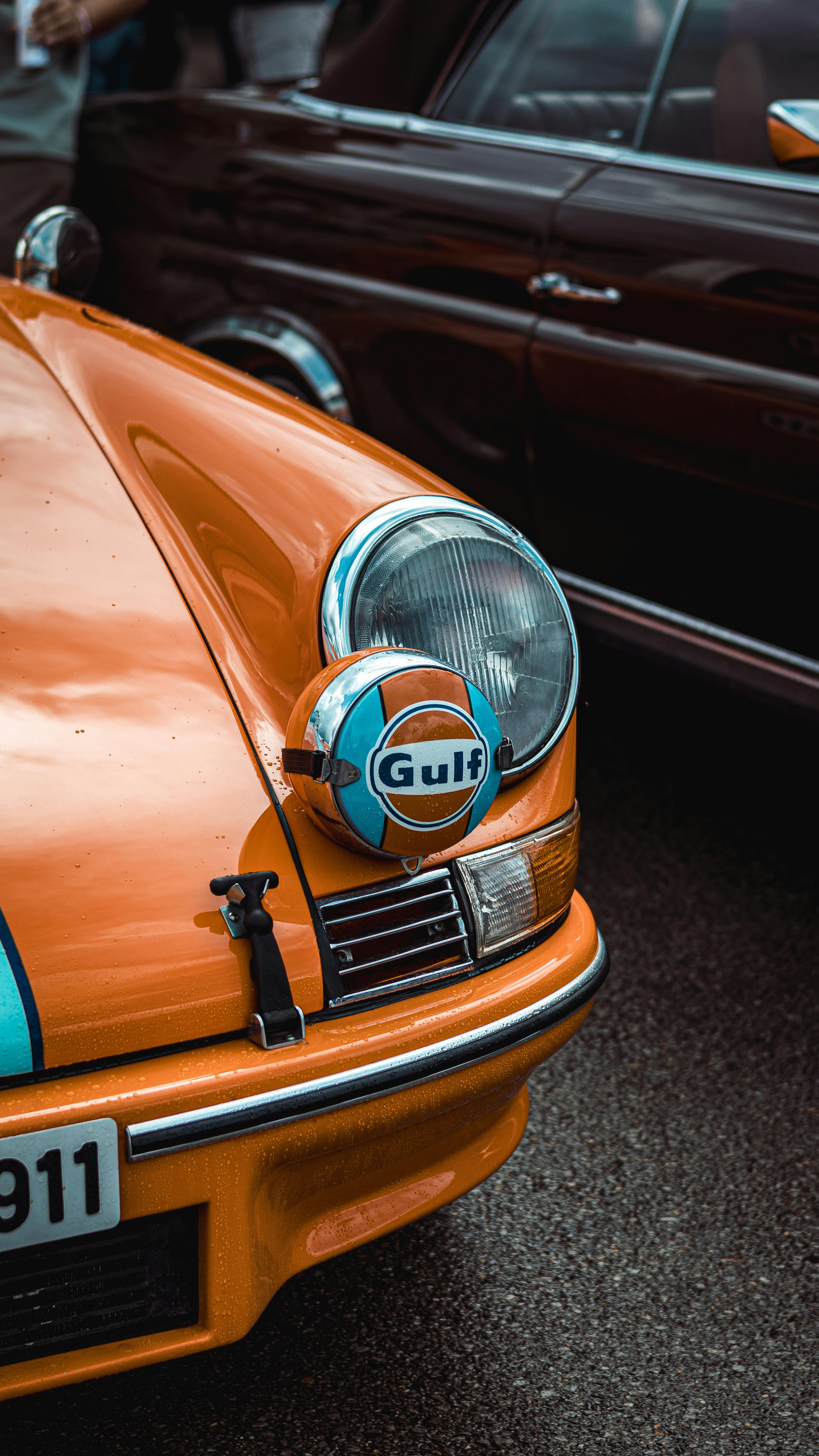 Close up Of A Vintage Orange Sports Car Free Stock Photo close-up-of-a-vintage-orange-sports-car-free-stock-photo
