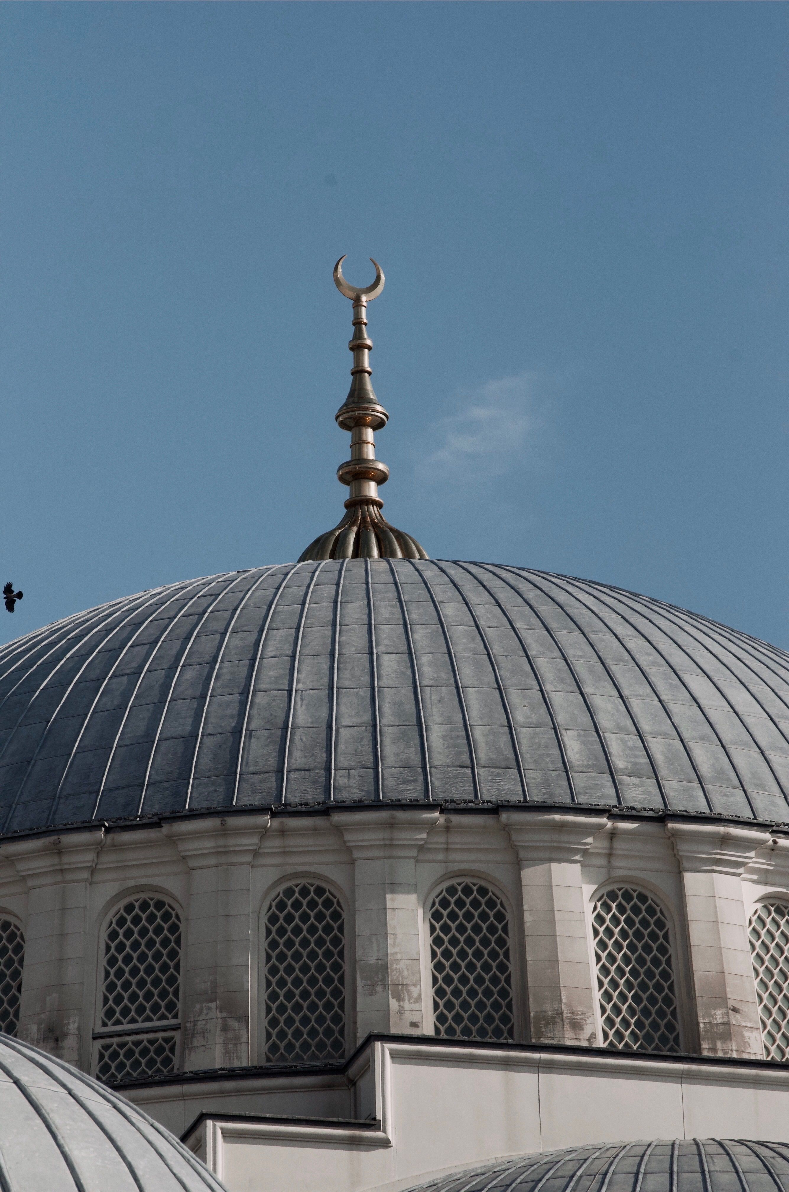 Elegant Dome with Islamic Crescent Against Blue Sky · Free Stock Photo