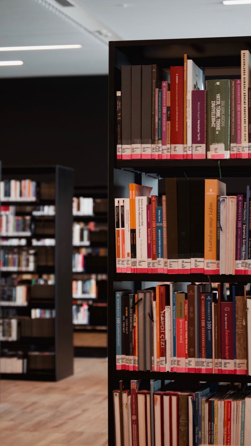 Rows of books on shelves in a library · Free Stock Photo