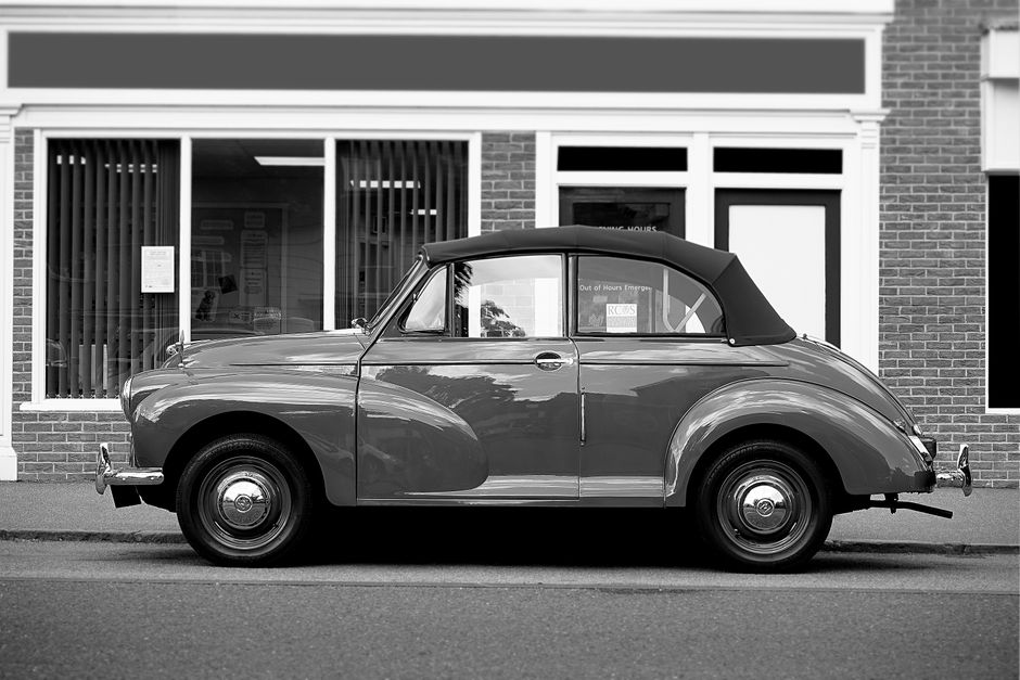 Classic black and white photo of a vintage car in Potton, England.