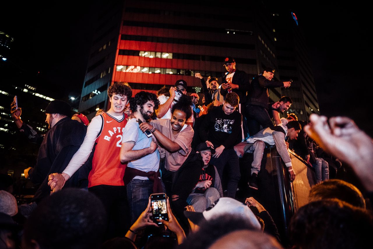 energetic crowd celebrating a night event in the city with joyful toge