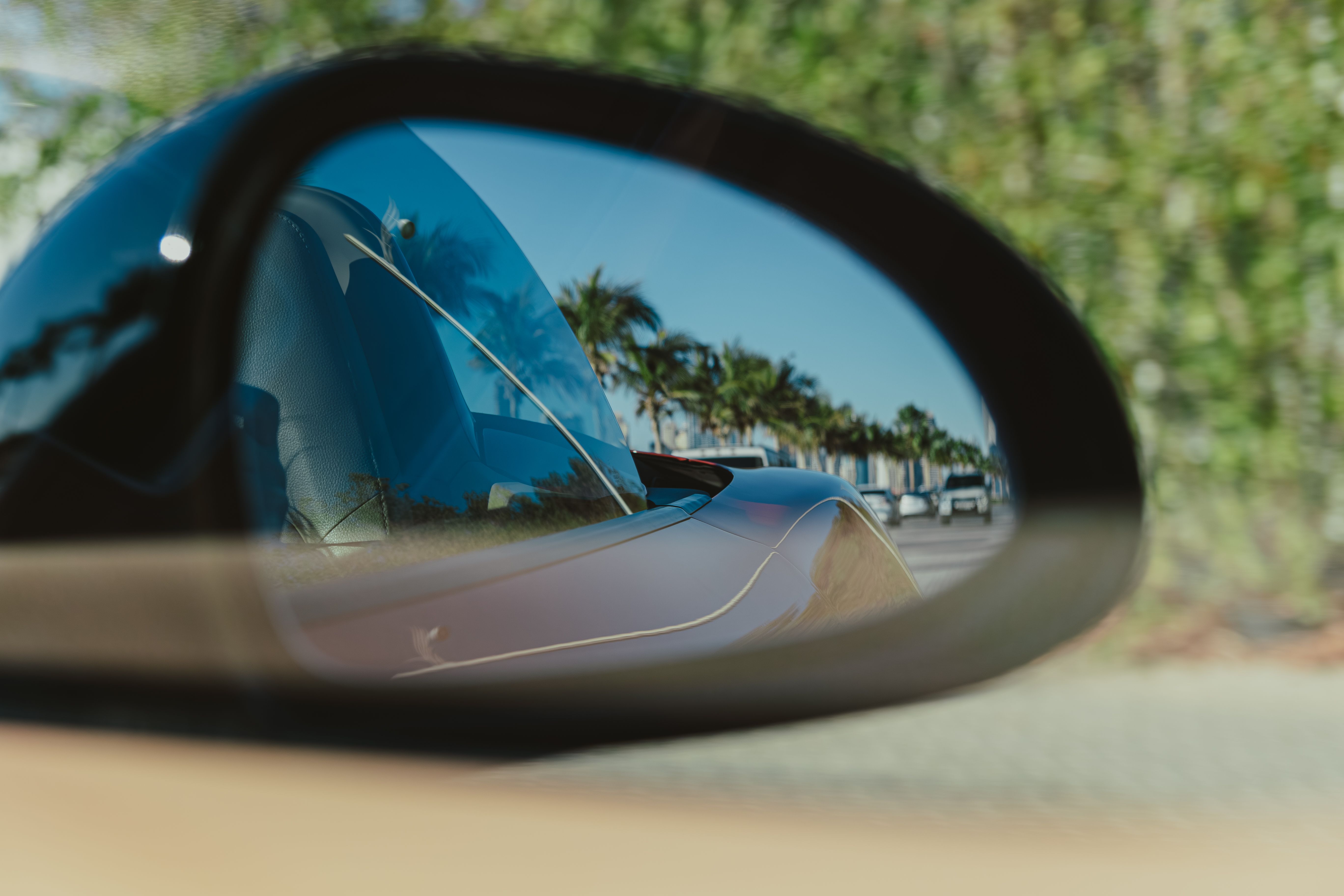 driving a luxury car and enjoying Dubai