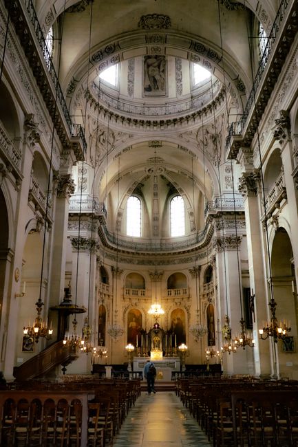 Explore the intricate design of a French cathedral's interior in Paris, showcasing its architectural splendor.