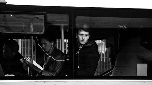 Free Monochrome image capturing passengers on a Buenos Aires bus, deep in thought. Stock Photo