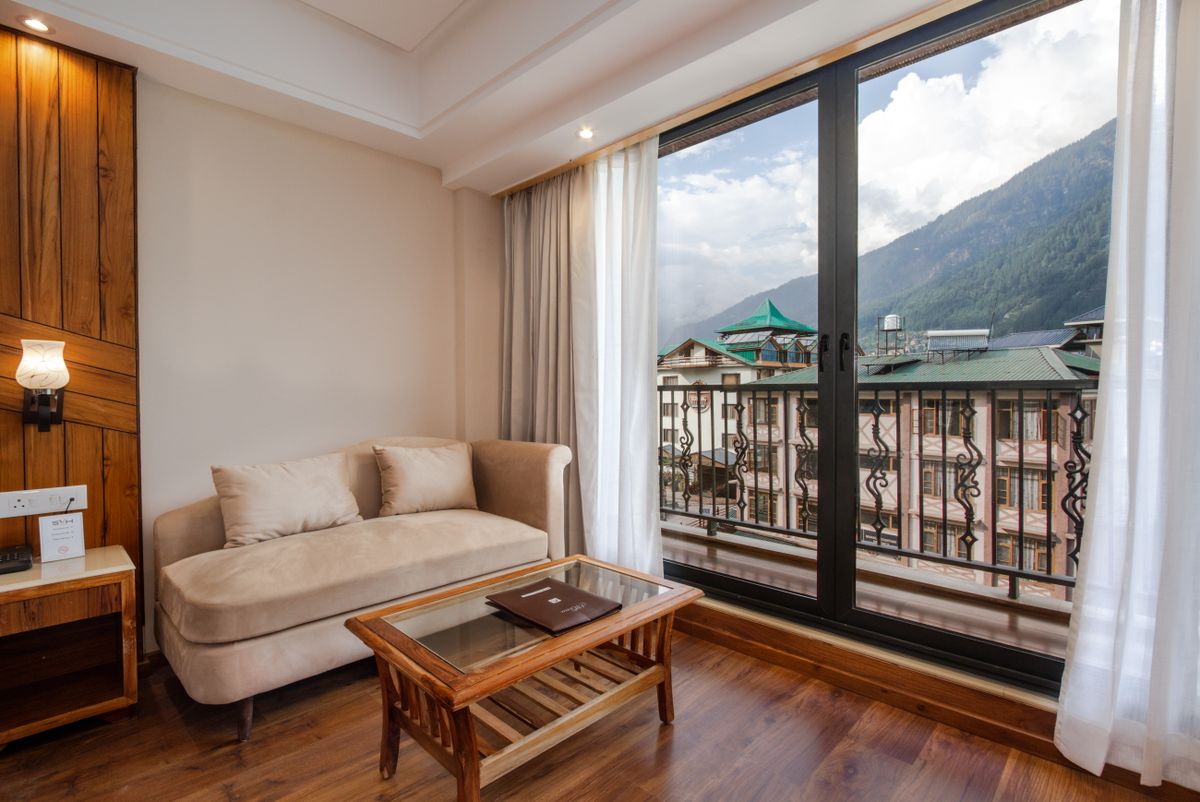 Apartment living room overlooking the mountains at Hotel Le Grand Chalet