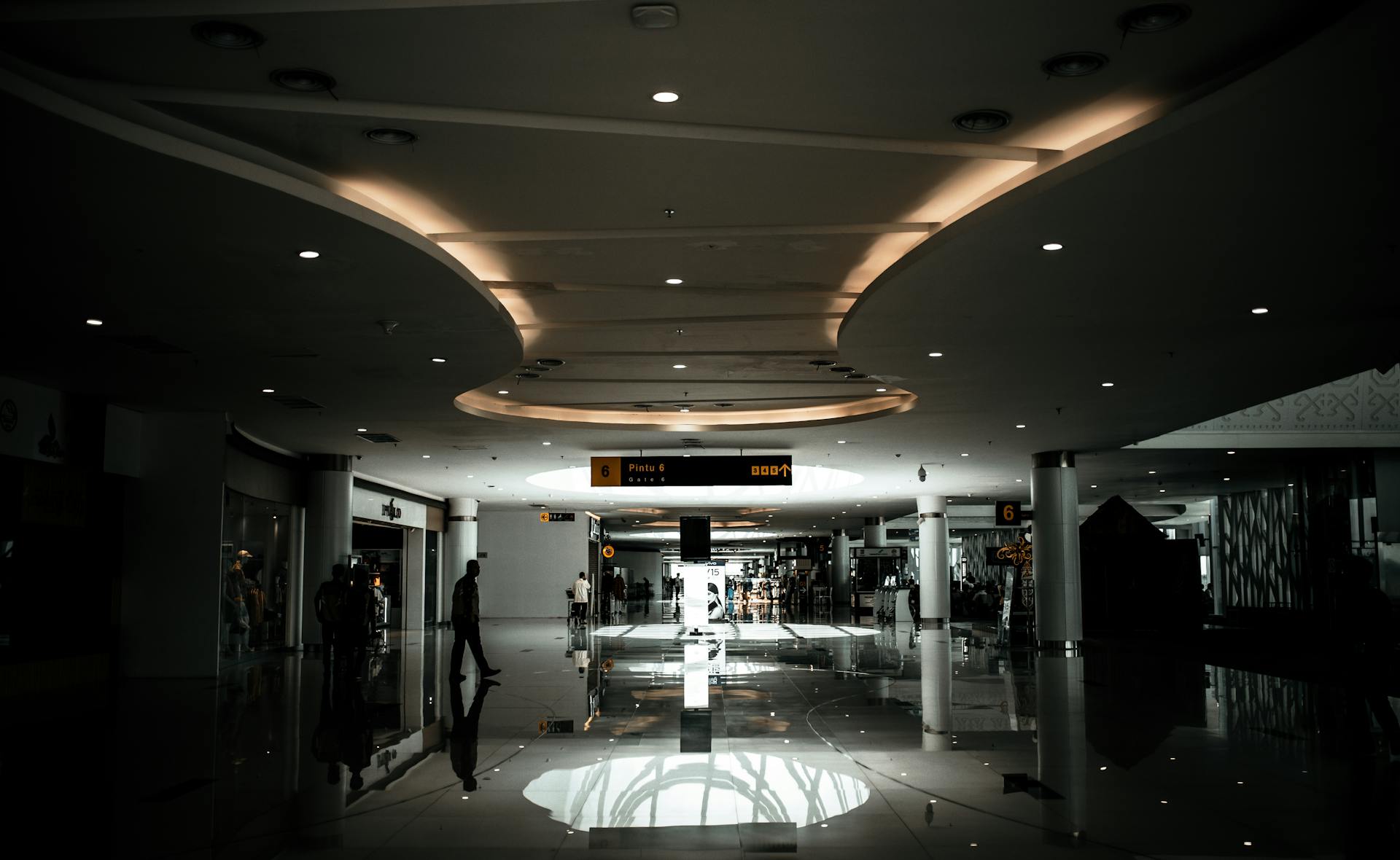 Sophisticated lobby with modern design and ambient lighting, featuring a spacious hallway.