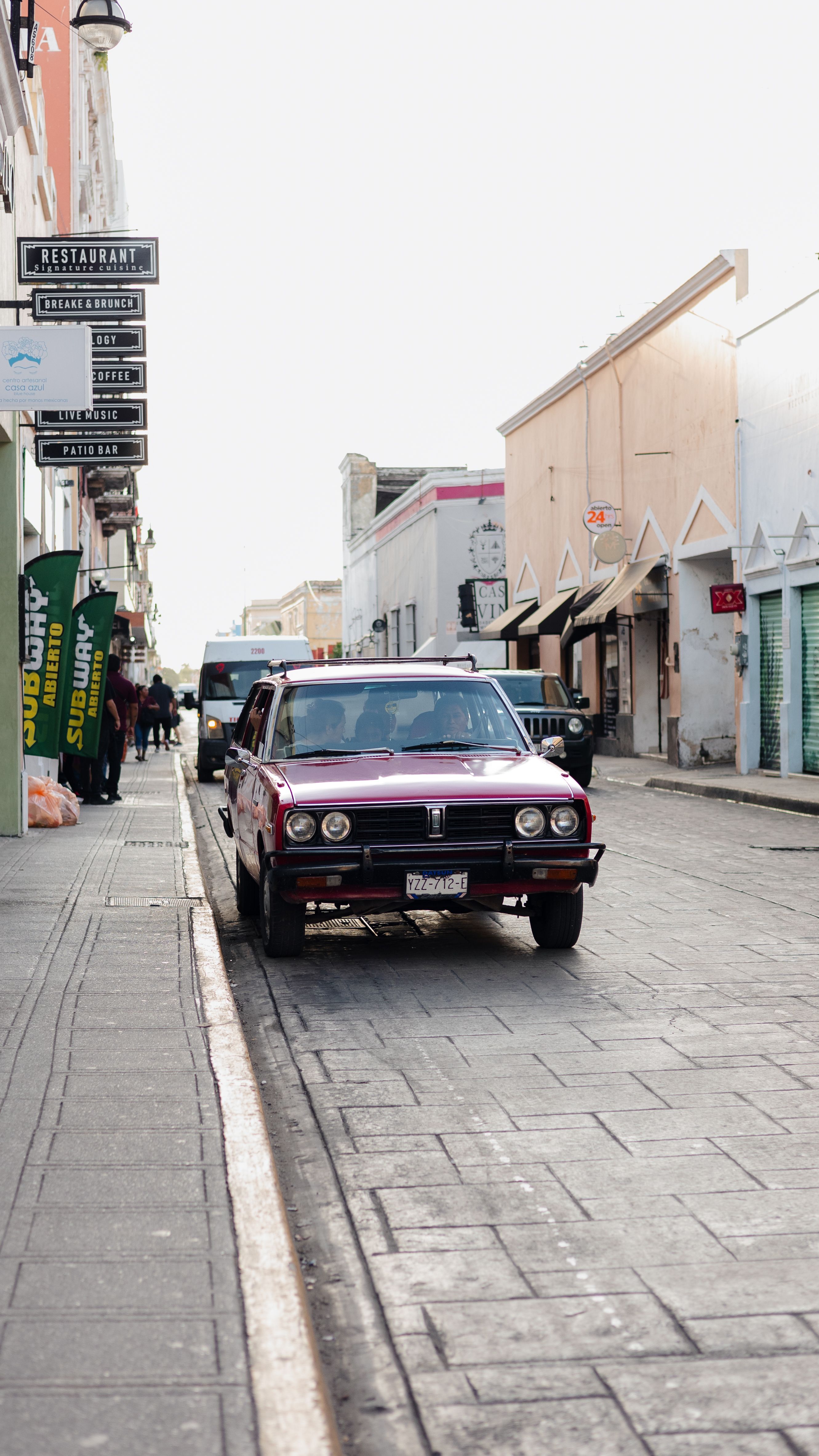 A car is parked on the side of a street · Free Stock Photo