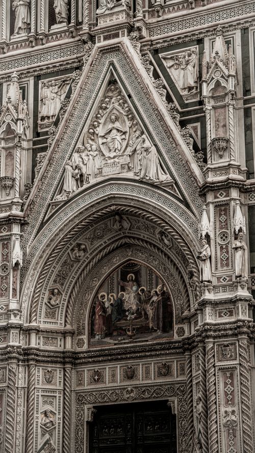 Free Detailed view of the ornate facade of Florence Cathedral, showcasing religious art and gothic architecture. Stock Photo