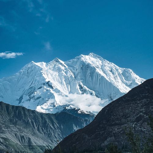 Free Stunning view of a snow-capped mountain peak against a clear blue sky. Stock Photo
