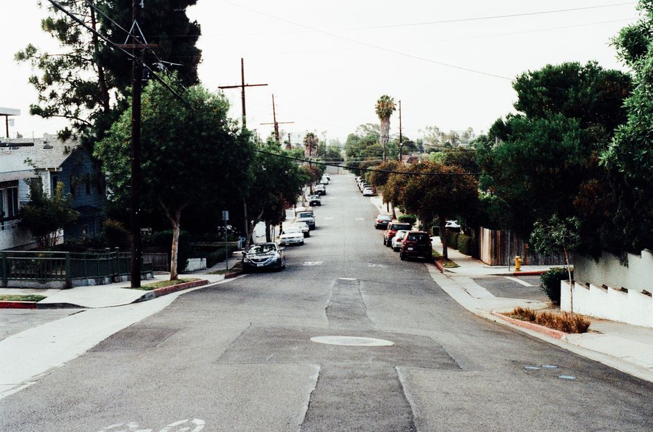 quiet suburban neighborhood street sunrise empty driveway