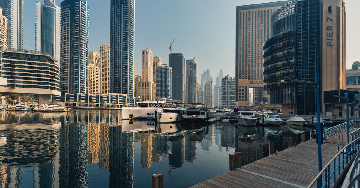 Explore the breathtaking skyline of Dubai Marina with iconic skyscrapers and luxury yachts.