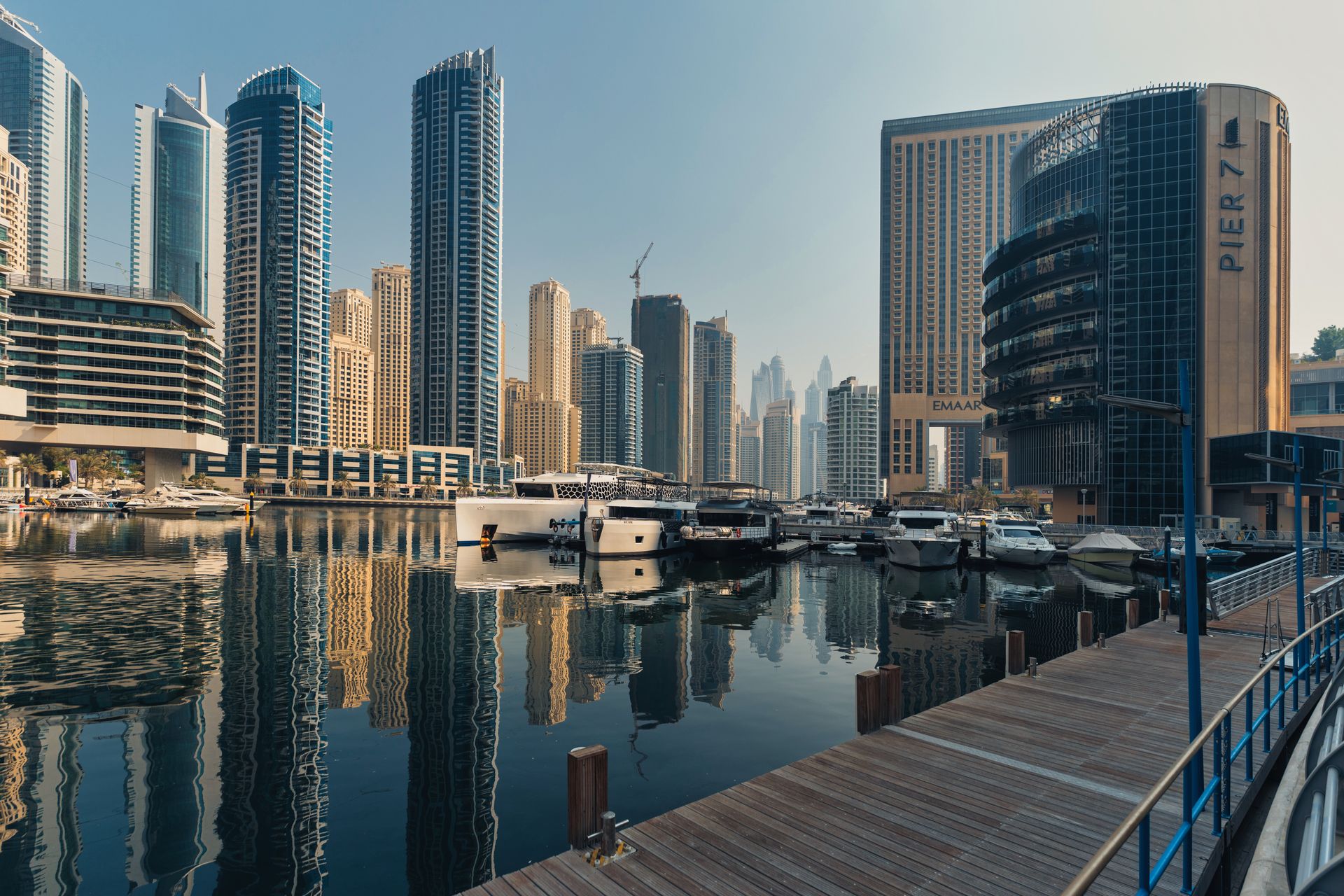 Explore the breathtaking skyline of Dubai Marina with iconic skyscrapers and luxury yachts.