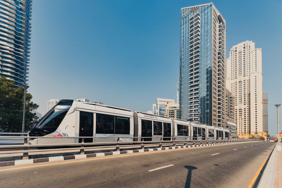Clean and modern interior of a Dubai Metro train carriage with seating