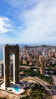 Stunning aerial image of Benidorm's modern skyline with iconic skyscrapers under clear skies.