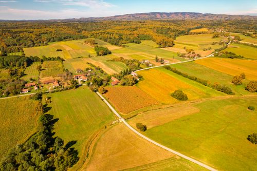Free Scenic aerial shot of colorful autumn fields and forests in Garešnica. Stock Photo