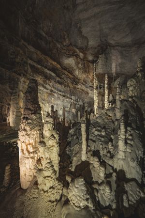 Stalactites hanging in a deep cave hall, photo by Francesco Ungaro on Pexels