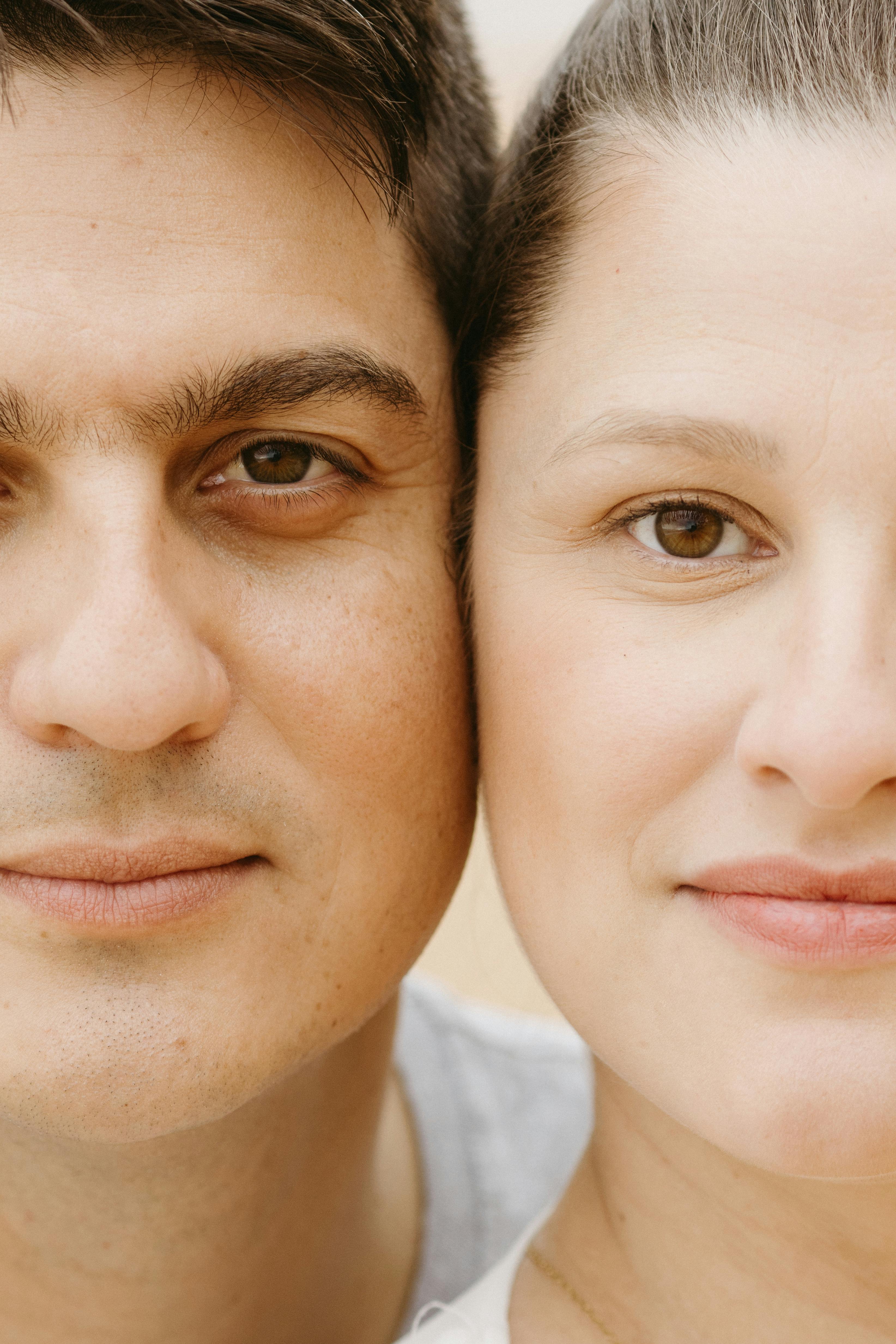 A close-up portrait of a smiling couple showcasing their facial expressions and features.