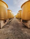 Yellow Containers Under Cloudy Sky