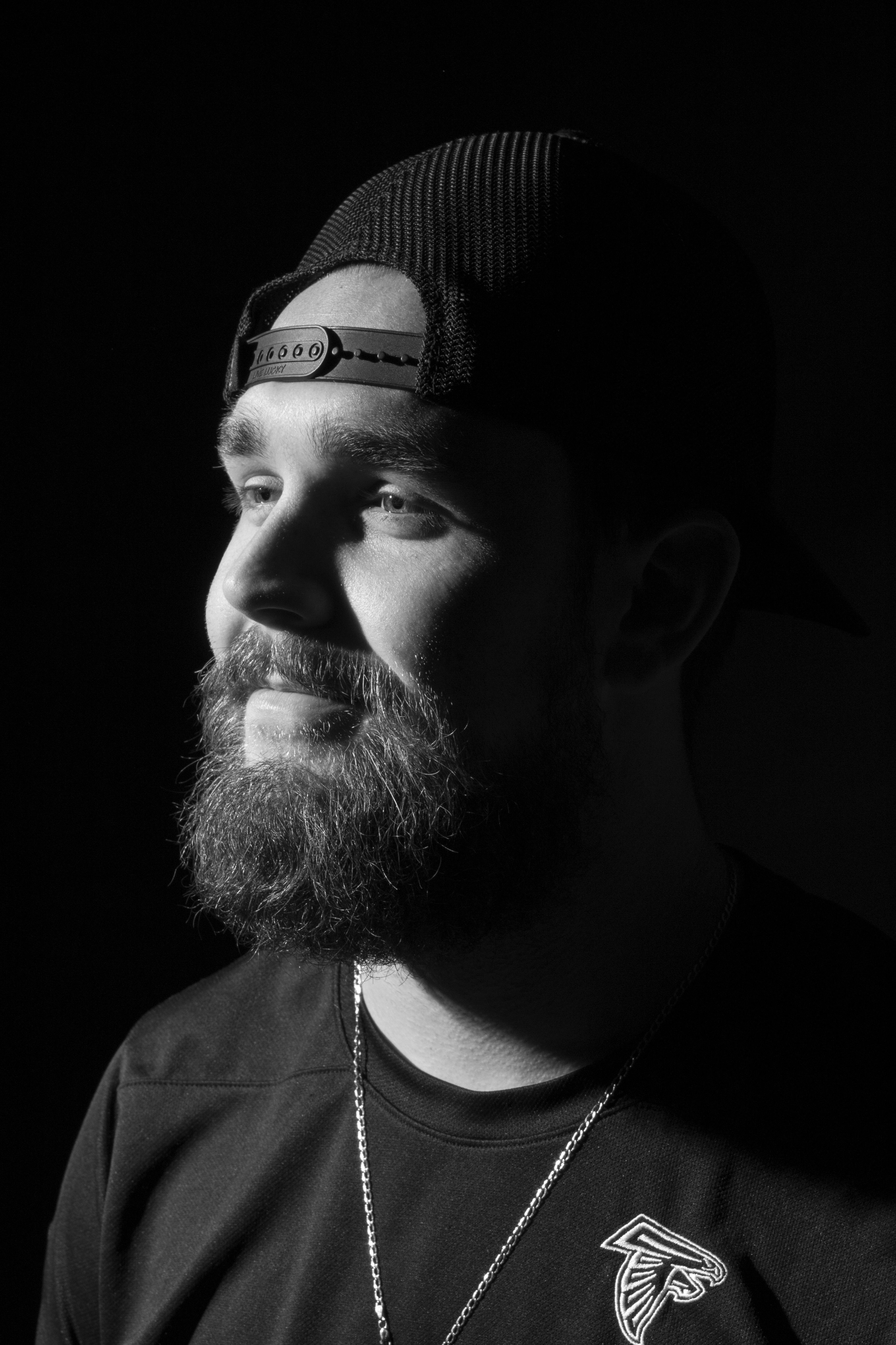 Monochrome portrait of a man with a beard wearing a cap, shot in York, PA, USA.