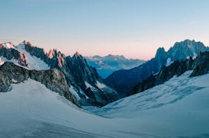 Photo Of Snow Capped Mountains During Dawn 