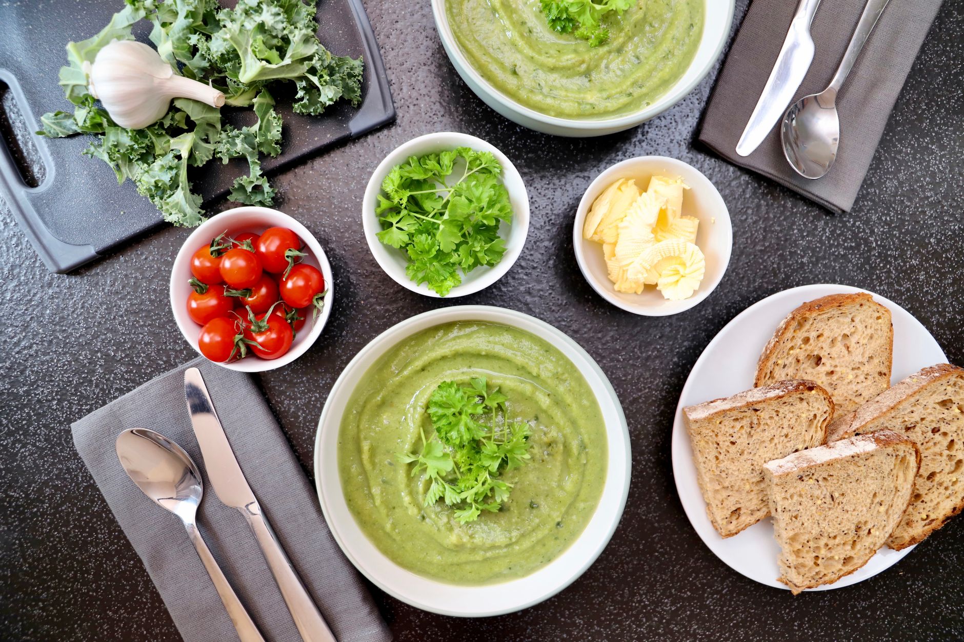 Sausage Kale and Lentil Soup in a rustic bowl with herbs