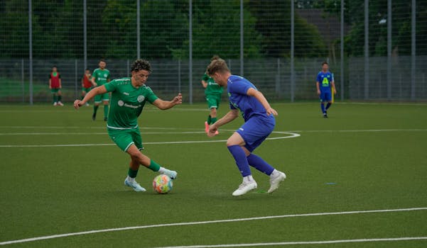 Two soccer players in action on the field, showcasing agility and skill during a competitive match.