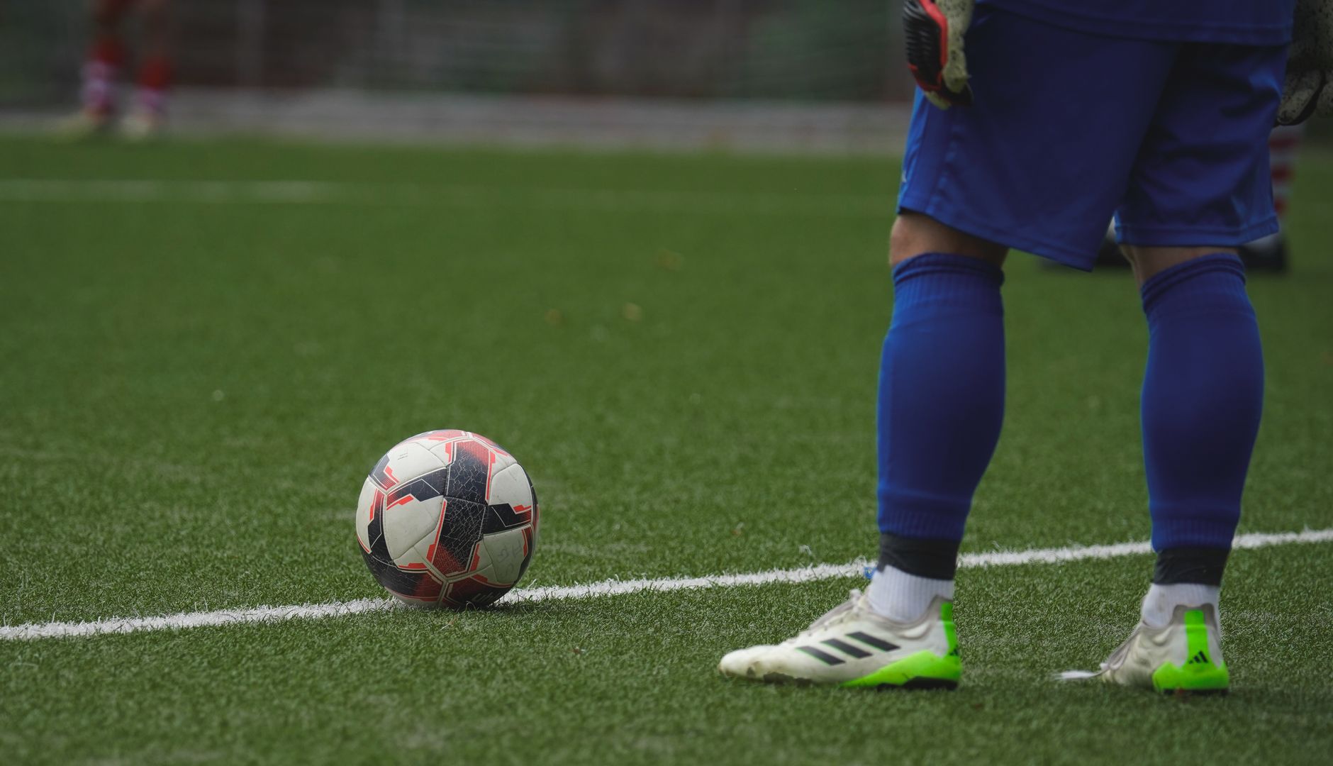 a football supporter checking kickoff time and JioHotstar connection settings on a smartphone