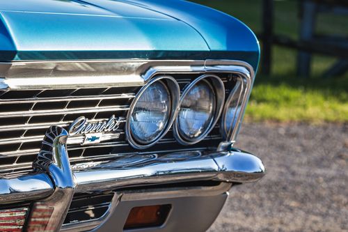 Free Close-up of a vintage 1966 Chevrolet Caprice in blue, showcasing its classic grille and headlights. Stock Photo