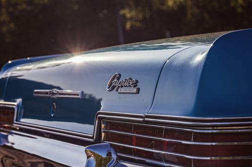 Free Close-up of a blue 1966 Chevrolet Caprice rear with vintage detailing under sunlight. Stock Photo
