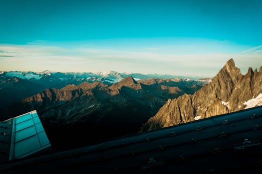 Breathtaking view of snow-capped mountains in the French Alps at sunset.