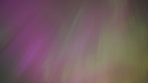 Captivating view of northern lights illuminating the night sky in vibrant colors.